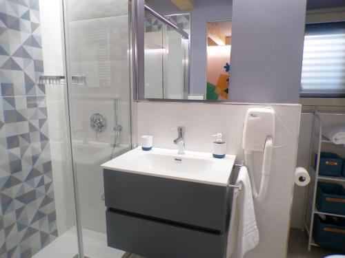 a bathroom with a sink and a shower at GRAZIA’S HOUSE in Mistretta