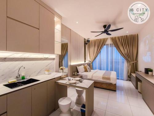 a bedroom with a bed and a kitchen with a sink at Sky Tree by JBcity Home in Johor Bahru