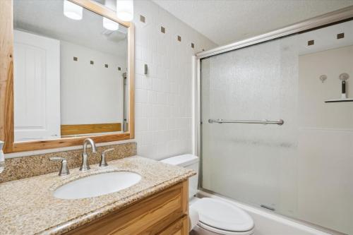 a bathroom with a sink and a toilet at Pinnacle B12 in Killington