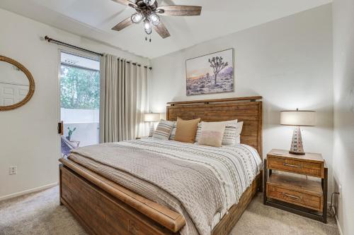 a bedroom with a bed and a ceiling fan at Scottsdale Condo with Fireplace and Community Pools! in Scottsdale