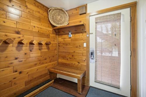 a sauna with a bench in a wooden wall at Trail Creek 57 in Killington