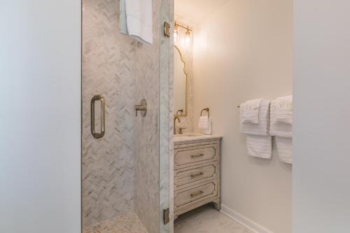 a bathroom with a shower and a sink at NEWLY Renovated Short Walk to Beach and Beach Club - Sleeps 12 in Fripp Island