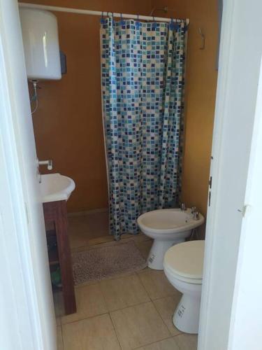 a bathroom with a sink and a toilet and a shower at depto muy cómodo en 1er piso in La Plata