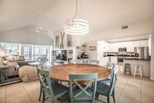 a kitchen and dining room with a table and chairs at New Listing! Private dock close to beach access in St. Helena Island