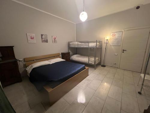 a small bedroom with a bed and a closet at Agriturismo La Palma Sambuca val di Pesa in Tavarnelle in Val di Pesa