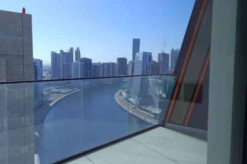 a view of a city skyline from a building at 1BR Canal View 10 min to Dubai Mall & Burj in Dubai