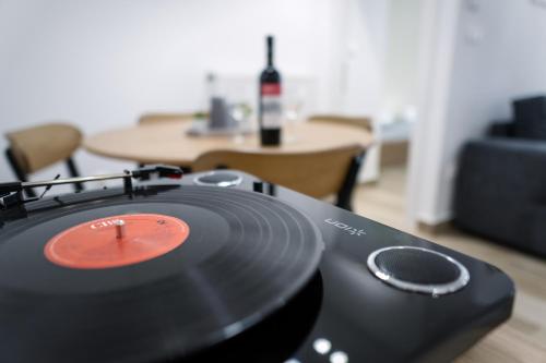 a vinyl record sitting on top of a table at Airbnb Kastoria - Bella Vista A in Kastoria