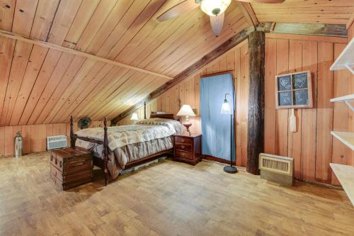 a bedroom with a bed and a ceiling fan at Pet-Friendly Opp Vacation Rental with Spacious Deck! in Opp