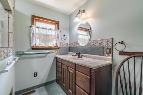 a bathroom with a sink and a mirror at Private Retreat on Deep Water overlooking Jenkins Creek in St. Helena Island