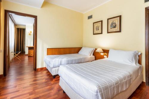 Una cama o camas en una habitación de Residence Villa EUR