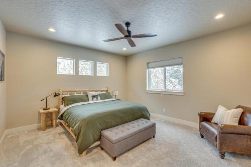 a bedroom with a bed and a ceiling fan at All-Season Cabin Hot Tub and Sauna in Donnelly in Donnelly