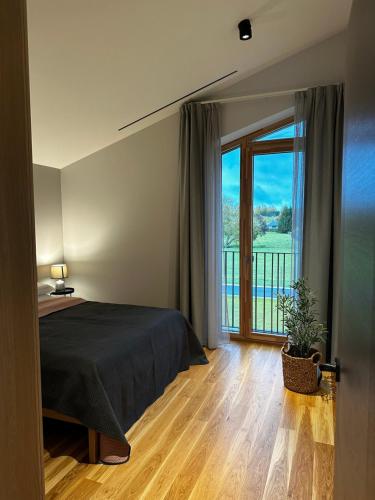 Ένα ή περισσότερα κρεβάτια σε δωμάτιο στο Idille2