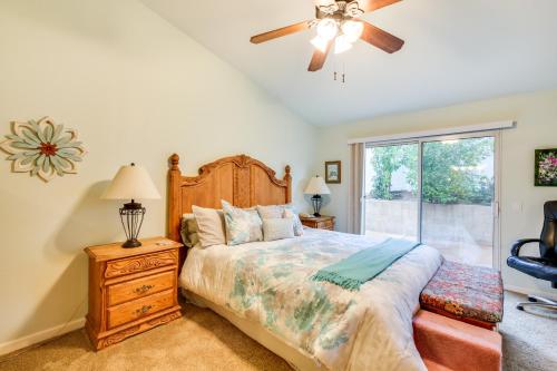 a bedroom with a bed and a ceiling fan at Peaceful El Cajon Vacation Rental with Patio and Yard! in El Cajon