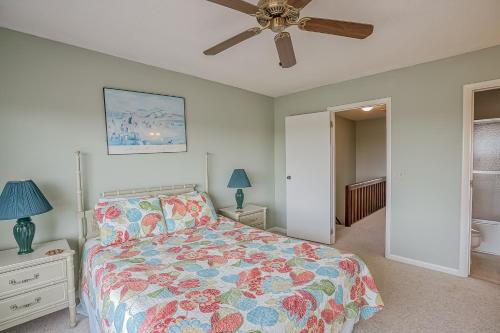 a bedroom with a bed and a ceiling fan at NEW LISTING! Two Bedrooms in A Building with Marsh and Ocean Views in Harbor Island