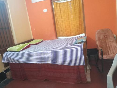 Tempat tidur dalam kamar di ABHINNA BANGLA - Group