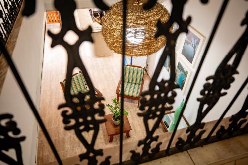 an overhead view of a stairway with a potted plant and shadows at Moriah Maceió Beach Hotel in Maceió