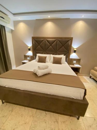 Ένα ή περισσότερα κρεβάτια σε δωμάτιο στο Hotel Comfort & Villas