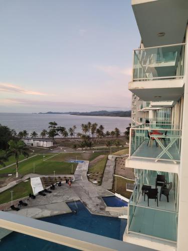 a balcony of a building with a view of the water at Paraiso Caribeño 706 in Colón