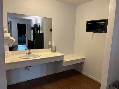 a bathroom with a sink and a mirror at Motel 6 Junction, TX Llano River in Junction