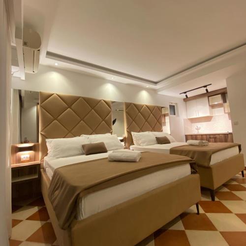 Ένα ή περισσότερα κρεβάτια σε δωμάτιο στο Hotel Comfort & Villas