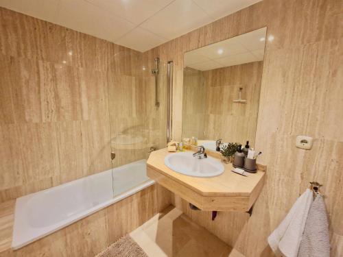 a bathroom with a sink and a shower and a tub at SR Santa Maria Golf Marbella with Sea Views in Marbella