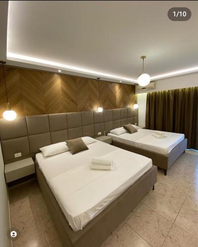 Ένα ή περισσότερα κρεβάτια σε δωμάτιο στο Hotel Comfort & Villas