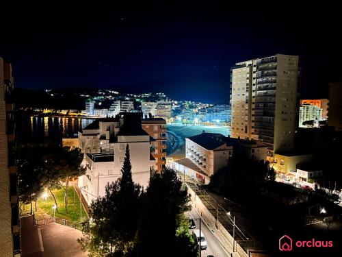 a view of a city at night with buildings at Bello Amanecer en La Concha in Oropesa del Mar