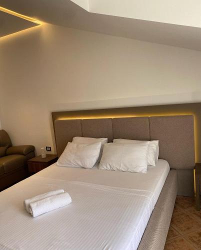 Ένα ή περισσότερα κρεβάτια σε δωμάτιο στο Hotel Comfort & Villas