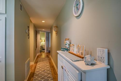a hallway of a home with a counter and a clock on the wall at New Listing! - Pool and Ocean View - Harbor Island Beachhouse in Harbor Island