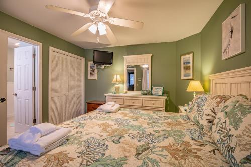 a bedroom with a bed and a ceiling fan at New Listing! - Pool and Ocean View - Harbor Island Beachhouse in Harbor Island