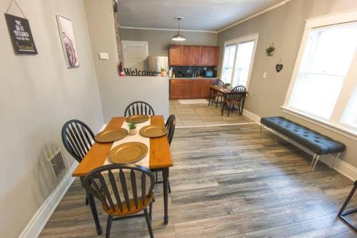 a dining room and kitchen with a table and chairs at Quaint 3BR 1 Bath near Niagara Falls in Niagara Falls