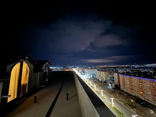 a view of a city at night from a building at My Sweet Home in Rustavi city 7 in Rustavi