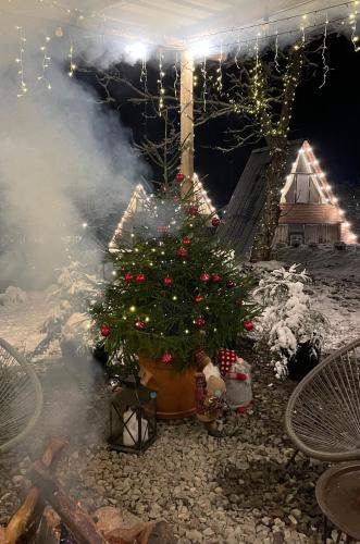 a christmas display with a christmas tree and lights at Landhaus Borjomi in Borjomi