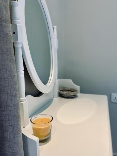 a bathroom with a toilet with a bowl on it at Petit Charlie @ Forest view in Bathurst