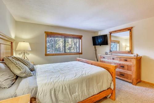 a bedroom with a bed and a dresser and a mirror at Colorado Condo about 2 Mi to Winter Park Resort! in Winter Park