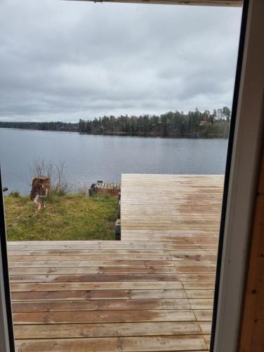a view of a lake from the porch of a house at Mulseryd in Bottnaryd