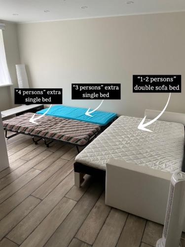 a room with two beds in a room at Valmiera City Centre Apartment in Valmiera