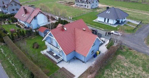 an aerial view of a house with a red roof at Willa Silver - Ścięgny koło Karpacza in Ściegny