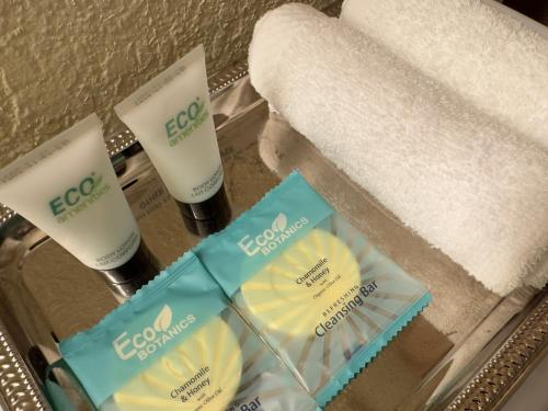 two bottles of soap and a towel in a bathroom at Zen Desert Home, Great Location in Sedona