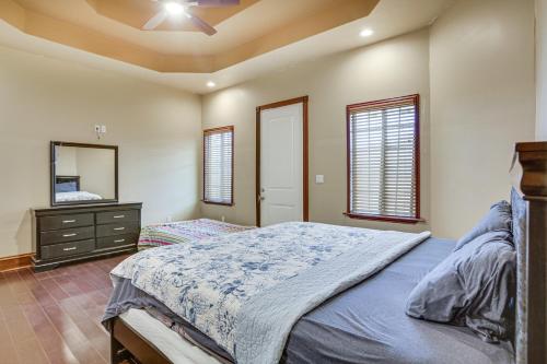 a bedroom with a bed and a dresser and a mirror at Immaculate New Orleans Home 7 Mi to Frenchmen St! in New Orleans