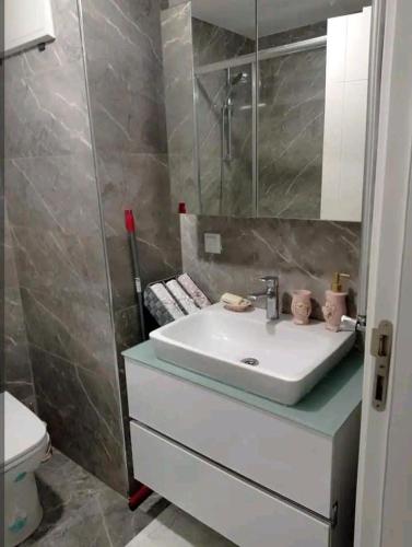a bathroom with a sink and a toilet at شقة انيقة مطلة على البحر in Istanbul