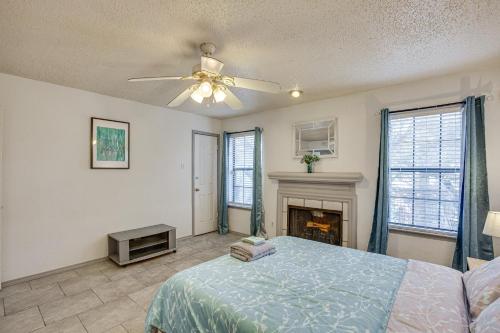 a bedroom with a bed and a fireplace at Inviting Dallas Condo Less Than 2 Mi to NorthPark! in Dallas