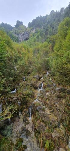 a mountain with waterfalls on a hill with trees at ΑΘΗΝΑ A7 in Katerini