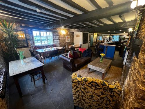 an overhead view of a living room with couches and tables at The Holford Arms in Tetbury