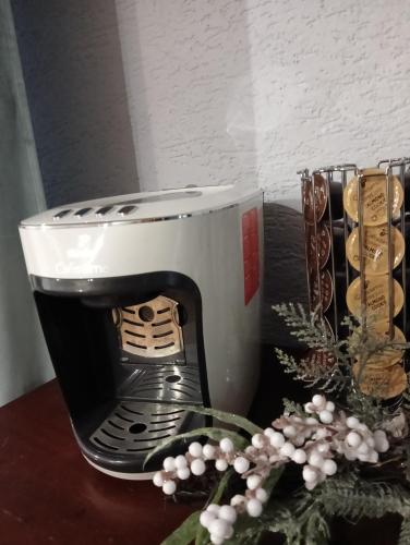 a coffee maker sitting on top of a table at Pod Kasztanami blisko A2 in Baranów