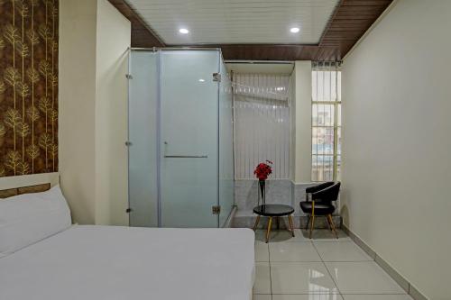 Ένα ή περισσότερα κρεβάτια σε δωμάτιο στο Super Hotel O Krishna Guest House & PG