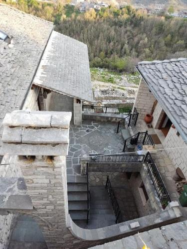 an overhead view of a stone building with stairs at Βίτσα Πετρόκτιστο Αρχοντικό "Ιόλη" με θέα Ζαγόρι in Vitsa