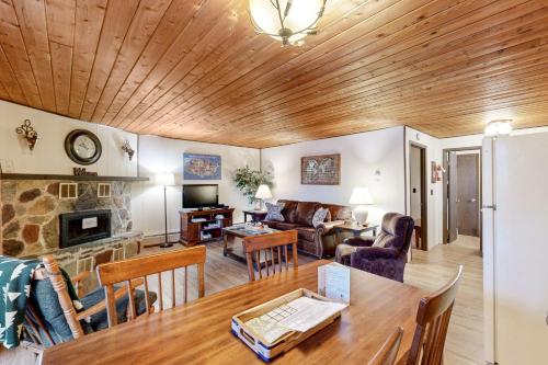 a living room with a wooden ceiling at Bay Point Hillside 17A Down in Whitefish