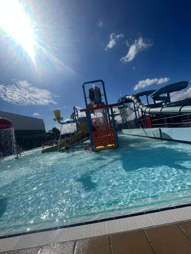 a large swimming pool with a water park at 208 Holiday Resort Unity Brean 6 berth Passes optional No pets in Brean