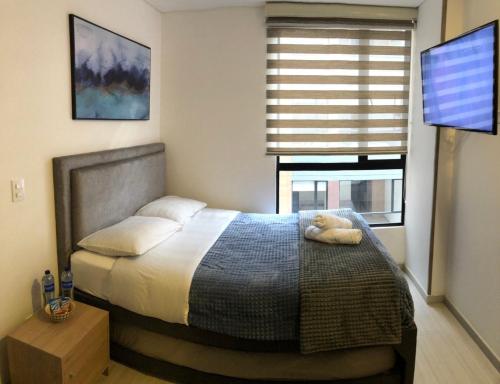 Postel nebo postele na pokoji v ubytování Hermoso Apartamento Chapinero